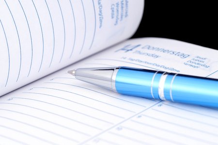 Ballpoint pen on notebook.の写真素材