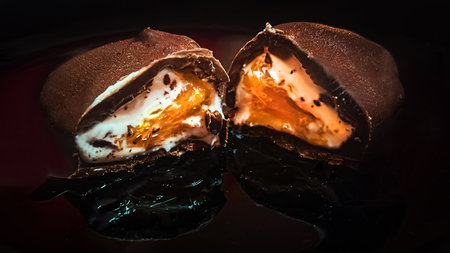 Chocolate cake with ice cream on a black background. Toned.の写真素材