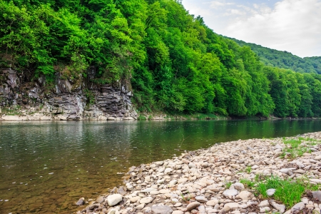 rocky coast and stony beach of a mountain riverの写真素材