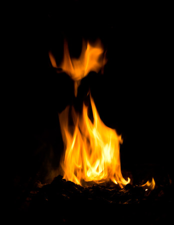 powerful high flame burning wood on black background in stoves 