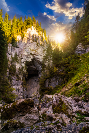 Cetatile cave in romania. Natural citadel sculpted by river in romanian mountains in evening lightの写真素材