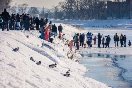 UZHGOROD, UKRAINE - January 19, 2017: Ice swimming in Greek-Catholic parishioner on Epiphany Dayのeditorial素材