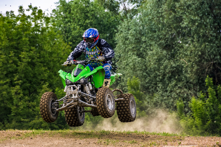 ATV Rider in Dirt Bike Jumping action. TransCarpathian regional Motocross Championshipのeditorial素材