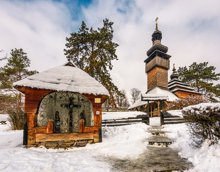 old orthodox wooden church in winter. location Museum of Folk Architecture and Life, Uzhgorod.のeditorial素材