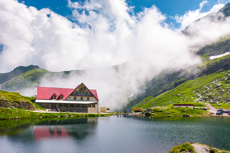 Fagaras mountains, Romania - Jun 26, 2017: rising clouds on lake Balea. beautiful summer landscape of popular tourist attraction. one of the most visited locations near the Tranfagarasan roadのeditorial素材