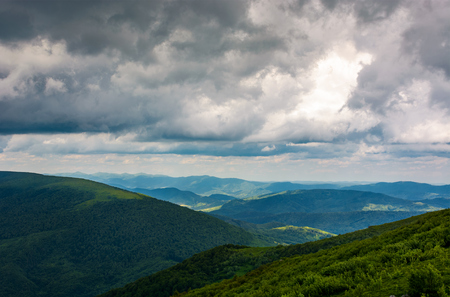 mountainous landscape before the storm. lovely scenery under the menacing heavy grey skyの写真素材