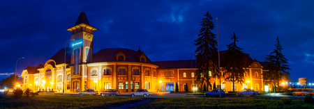 Uzhgorod, Ukraine - SEP 28, 2008: Panorama of beautiful railway station building at nightのeditorial素材