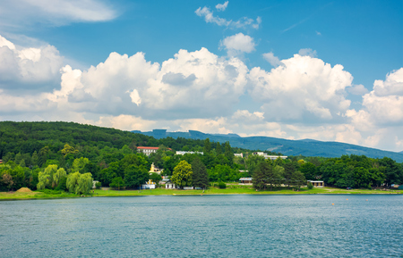 shore of Zemplinska Sirava, Slovakia in summer. beautiful and calm scenery of one of the largest Slovakian body of water. Vihorlat Mountains in the distanceの写真素材