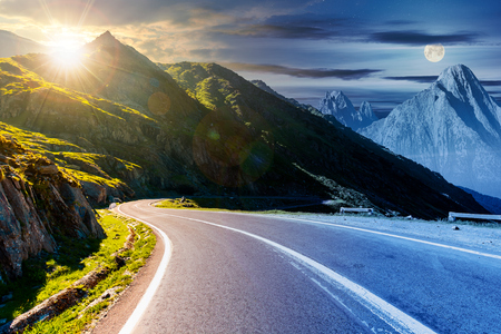 road in mountains with rocky ridge in the distance. composite image. travel by car conceptの写真素材