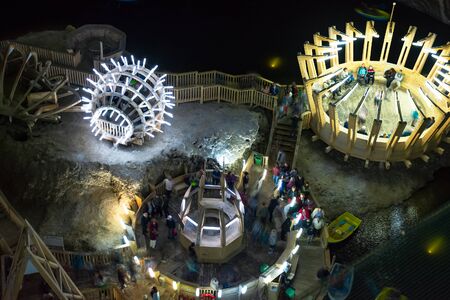TURDA, ROMANIA - APR 30, 2018: Island on the underground lake in Salt Mine Salina Turda museum