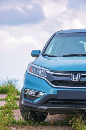 mnt. runa, ukraine - jun 22, 2019: honda cr-v suv on a paved platform in mountains. popular family vehicle, in cyan blue color. cloudy day and even light. explore back country by carのeditorial素材