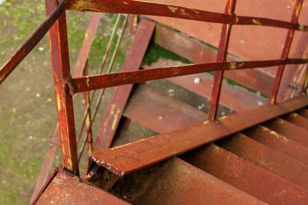 metal stairs. abandoned urban background full of rusty texture. view downsideの写真素材