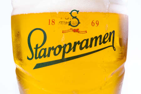 uzhgorod, ukraine - SEP 02, 2015: czech light beer. logo of a popular staropramen brand on a glass. white backgroundのeditorial素材