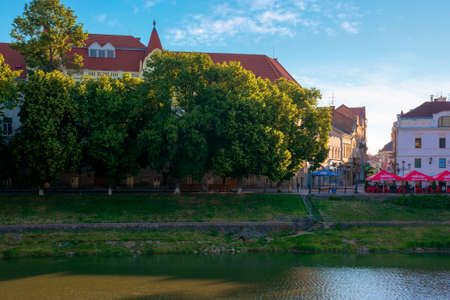 UZHHOROD, UKRAINE - JUN 04, 2017. beautiful sunny morning in uzhgorod. embankment of the river uzh...