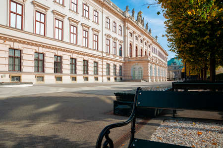 vienna, austria - OCT 17, 2019: terrace on the backside of albertina museum building. cafe and restaurant place. benches under the trees in fall foliage. sunny afternoonのeditorial素材