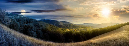 day and night time change concept above mountainous countryside. beautiful panorama of carpathians with sun and moon. valley of borzhava ridge in the distance. clouds on the skyの写真素材