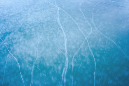 blue ice crack texture. frosty outdoor background in winter