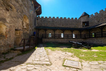 Stara Lubovna, Slovakia - 28 AUG 2016: ancient cannon in the inner courtyard of the castle. great stone walls of a fortrece. popular travel destinationのeditorial素材