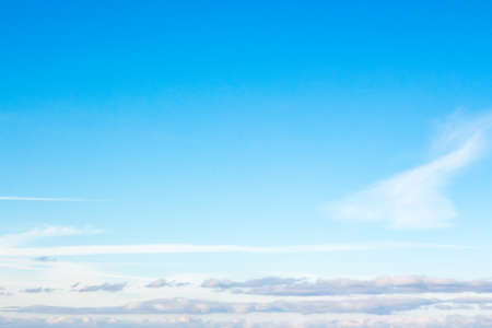 white fluffy clouds on a deep blue sky. sunny weather conditions