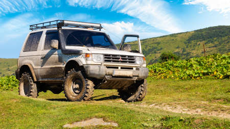 kvasy, ukraine - AUG 22, 2020: off road ready 3 door mitsubishi pajero on the hill. dirty 4x4...