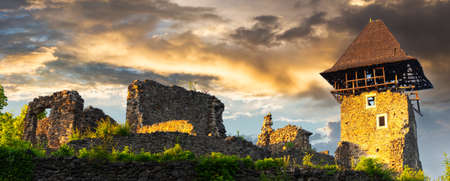 panorama of the nevytske castle. ruins of ancient fortress in evening light. popular travel destination of ukraineの写真素材