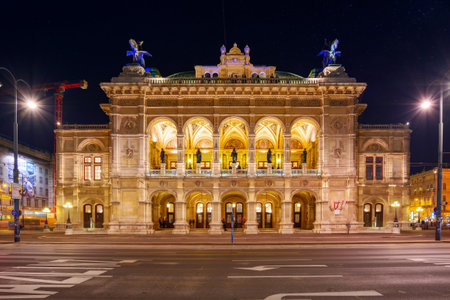 vienna, austria - oct 17, 2019: facade of famous opera house at night. popular travel destinationのeditorial素材