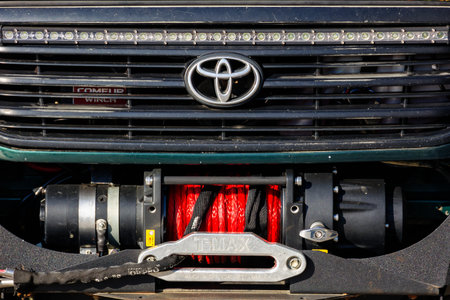 uzhgorod, ukraine - oct 31 2021: toyota landcruiser grill with mascot and winch. true off-road vehicleのeditorial素材