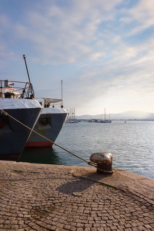 sozopol, bulgaria - 19 aug 2015: ships moored in harbor at sunset. beautiful scenery with distant mountains on the shore in evening lightのeditorial素材