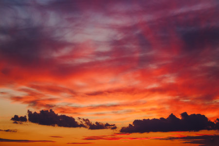 changing weather forecast. red clouds on the evening sky. dramatic sunset backgroundの写真素材