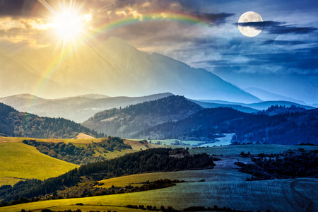 Rural landscape with fields and forest at the foot of mountains. day and night time change concept. countryside scenery with sun and moon at twilight. duality and transition templateの写真素材