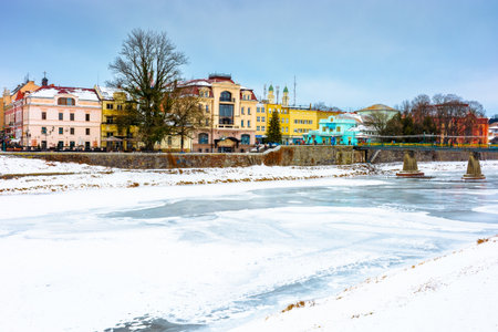 uzhhorod, ukraine - 09 jan 2017: christmas time in the old town in winter. snow covered embankment of ice frozen river uzh. cold weather. timeless photo of transcarpathia capital on holiday seasonのeditorial素材