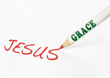 A Grace labeled pencil writing the word Jesusの写真素材