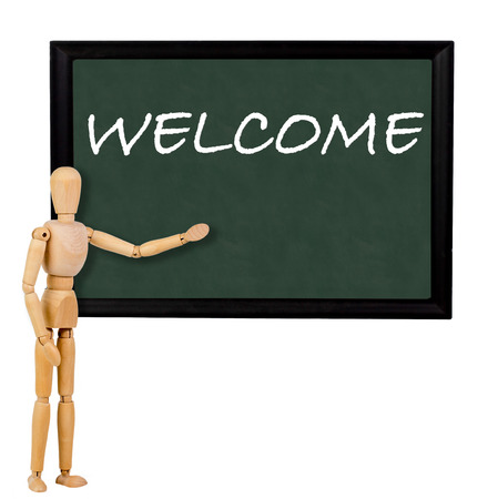 mannequin pointing to blackboard with the text "welcome"の写真素材