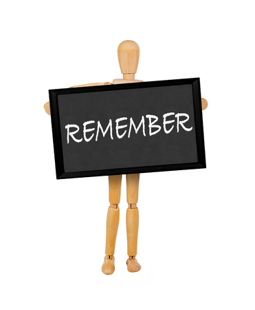 mannequin holding a  blank blackboard stating 'remember'の写真素材