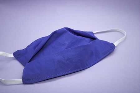 A surgical mask, surgical mask, chinstrap, face mask, or face mask is a type of self-filtering mask or mask used by medical and healthcare personnel to contain bacteria from the nose and mouth.の写真素材