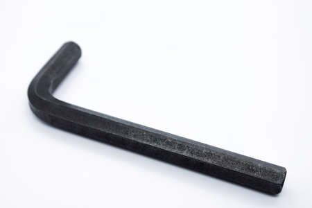 Allen key with hexagonal socket in the head, colored black on a white background