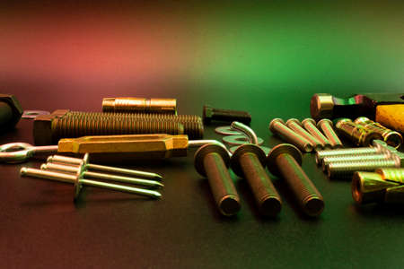 Set of tools, screws, anchors, tensioners and washers on  black