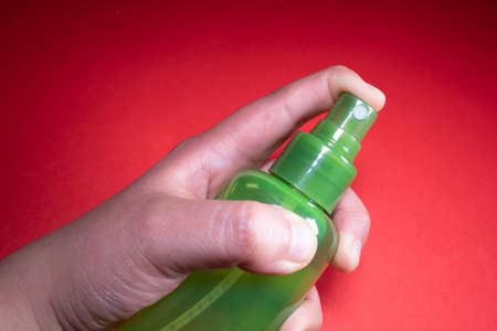 plastic bottle filled with red backgroundの写真素材