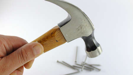 Tool to hit, to nail and remove nails, consisting of a head normally square or round on one side and...