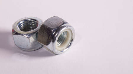A nut is a mechanical part with a central hole, which has a thread, which is used to attach a screw,...