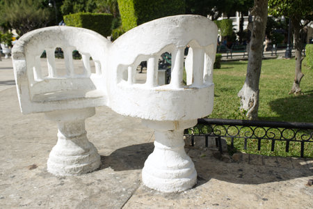 White chairs better known as confidant chairs, originally from Yucatan, Mexico. They are white and found, they are also known as loversのeditorial素材