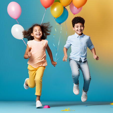 Cheerful kids jumping with balloons and confetti on blue background, Children's Dayの素材