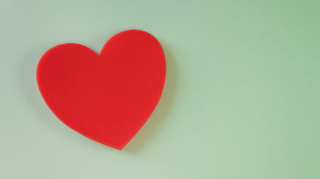 Red heart on a green background. Valentine's day. Love.の写真素材