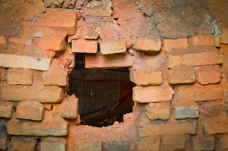 hole in brick wallの写真素材