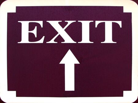 exit sign with an arrow pointing upの写真素材