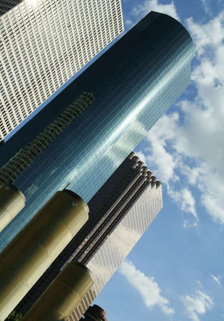 business building with reflection of puffy cloudの写真素材