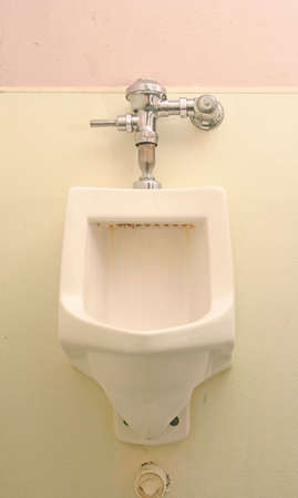 classic dirty urinal in the restroom