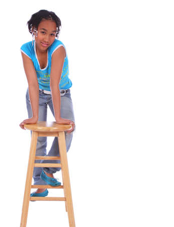 isolated african american girl lean forward holding to wood bar stool