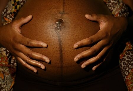 african american woman feeling the  with both of her handの写真素材