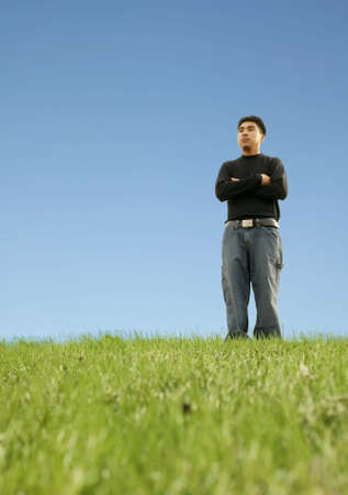shot of a man standing on a grass. concept shot of looking to the future. with copyspaceの写真素材